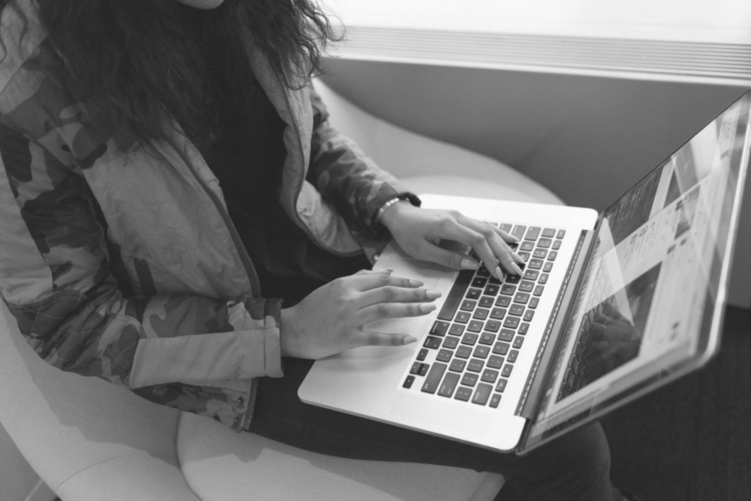 Close-up of hands working with financial charts